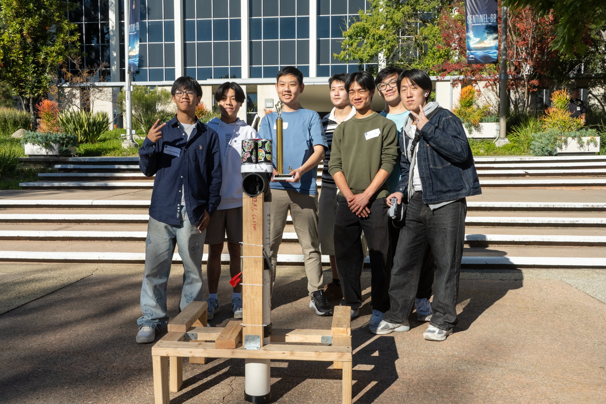 Team Still Water with their trophy and Bucket Brigade device at JPL.